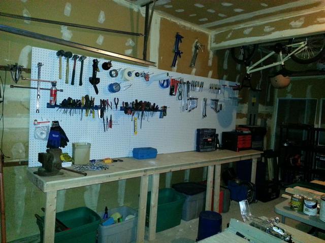 58:  Some pegboard, a few 2x4s and some sanded birch plywood made a nice little bench area.