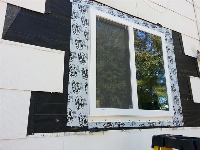 77:  Next, Lauren tests the strength of the glass pane with a claw hammer for good measure.