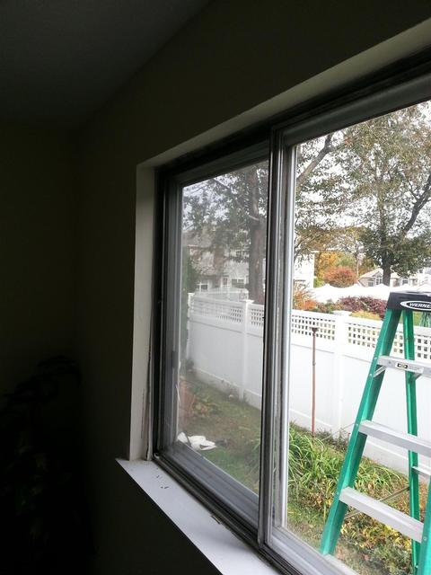 83:  We follow the same process as before. Flash, caulk, set, shim, screw, and flash again. Both windows are now in.