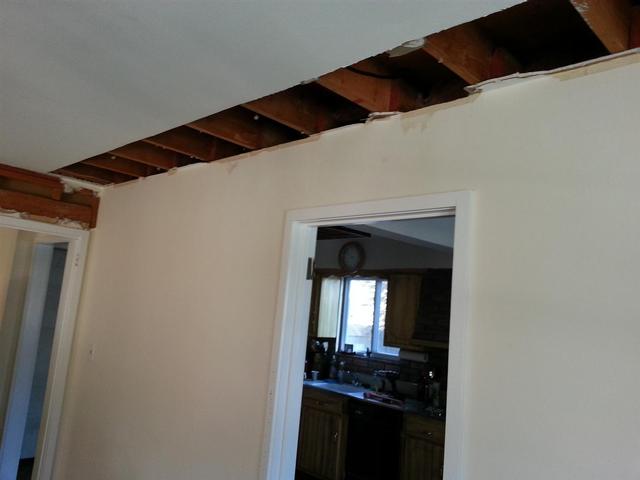 87:  We started by snapping a line on the ceiling 16 inches away from the wall, and pulling back the drywall.