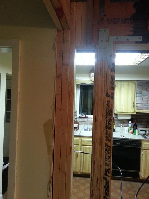 111:  After another trip to the hardware store, I picked up some beefier brackets, and lag bolted them in. This beam isnt going anywhere.