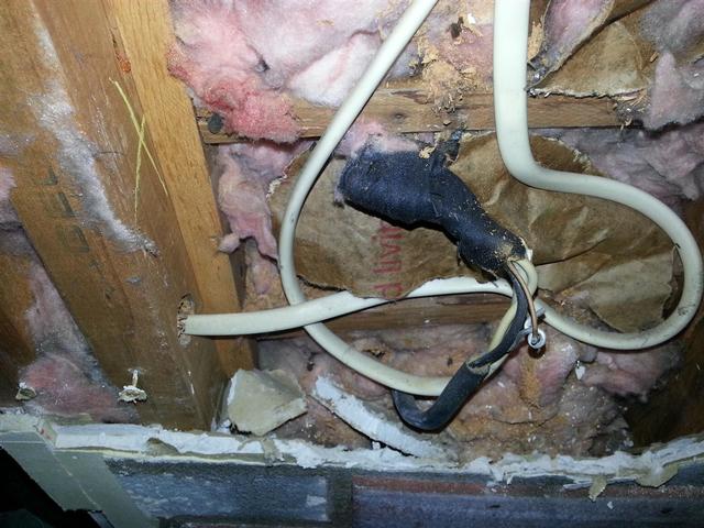 125:  Another buried treasure. This was a live splice to the exhaust vent stuffed in the wall. No electrical box, just wire nuts and cloth tape buried behind sheetrock. Whoeve last worked on this house was a real clown.