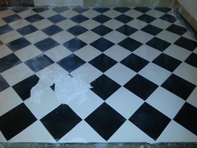 133:  Here is it with the grout. We scraped out the excess thinset between tiles, and applied grout. Sponged it down after an hour or so. Cleaned it us as best we could and let it set overnight. In thge morning I dry buffed the haze off the tile.