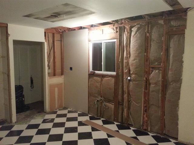 134:  Here's the first bit of sheetrock going back on the wall.
