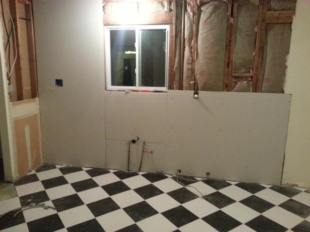 135:  Had to split the sheetrock around the sink drain. I also have the dishwasher romex and range cable through temporary holes.