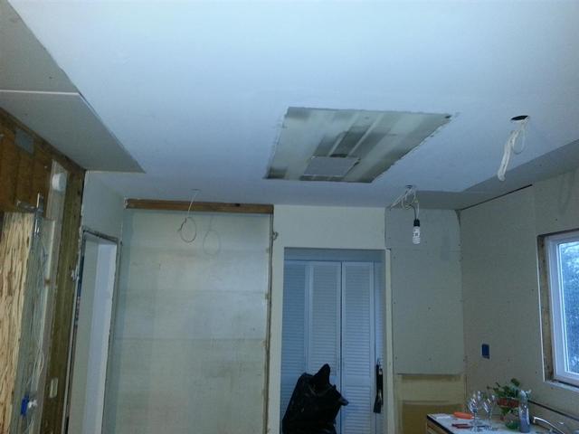139:  We removed the old light fixture boxes and cut and patched rectangular sheetrock sections to  get to the joists.
