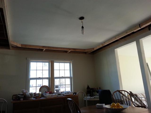 173: We framed out the tray ceiling with random leftover 2x4s.  We screwed them in toe nail style, and then nailed hurricane ties in a few locations to shore things up.   We also added insulation against the rim joist on the exterior wall.