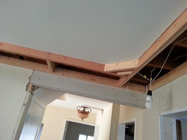 174: On the short sides of the room, we cut down 10 foot 2x4s since we didnt want a splice, as there are no floor joists to tie into.  Then we started running romex for the pot lights in each corner.  We also have the speaker wire run to the two locations.  