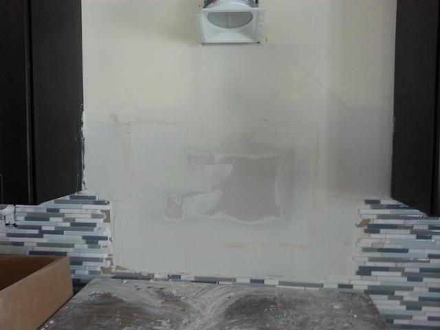 209: We had to patch a large secion of sheetrock after pulling off the tile.