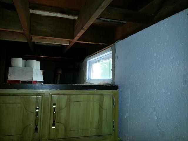 214: We installed three basement windows today.  What a giant pain in the ass.   The old steel frames were rusting, so we decided to completely pull them out.  First we cut them with the angle grinder and sawzall on all four sides, then tapped it with a hammer to break the steel bonds, then finally pried the frames out.  More often than not, huge chunks or the surrounding foundation came out.  The rapir was easy enough, even though its a little rough around the edges.  