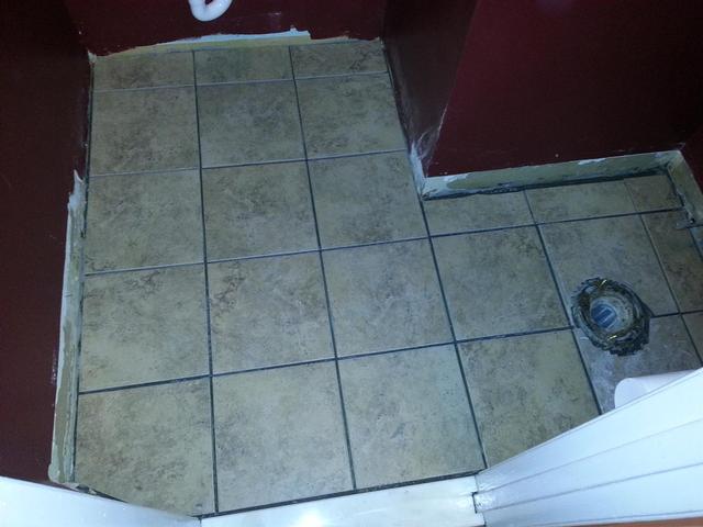 223: Here is the tile, on top of the underlayment.  Due to the thick layer of thinset below the decoupling membrane, we had a difficult time getting the tile hights even.  We also had some spacing issues, but luckily the rustic edges will help hide things once the grout goes in.  Thanks to my buddy Nick for giving me a hand this weekend.