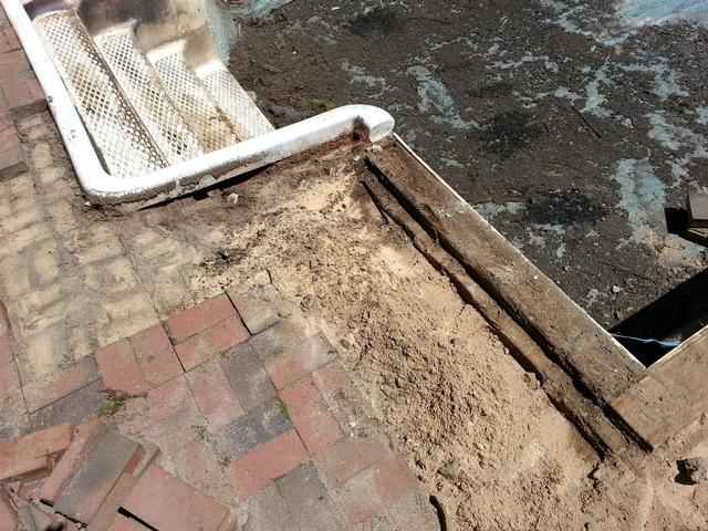 238: The deconstruction begins.  We pulled back the first few courses of brick to expose the wood beam.