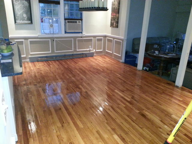 286: After much more sanding with the orbital, half sheet and belt sanders, the first coat of poly goes down.  What a difference.  I wish I hadn't filled the cracks in with wood putty though, I would have much preferred the imperfections to the look of the putty.