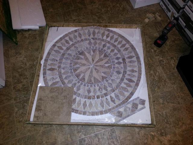 314: Our mosaic tile medallion has finally arrived.  Here it is along side the regular 12