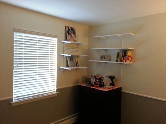 348: We put up a couple of book shelves to display the numerous pictures of Spencer.