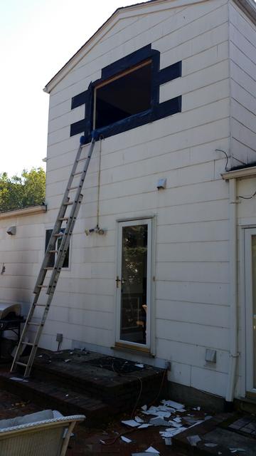 371: This was the scariest window to replace.  Its the big slider in the office, and we're replacing it with a twin double hung window.  I did what little work I could from the inside of the house, but at some point I had to work at with both hands full at teh top of this ladder.  I hate heights.