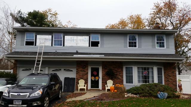 381: The siding goes up.  The tops and bottoms of the windows were most difficult to trim out for the slightly larger windows.  Its so much easier working with the integrated J channel - It cuts the work in half if not better.