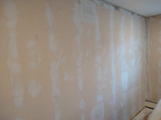 461: With the furring strips removed, there was a TON of sheetrock work  to fix up the old walls.