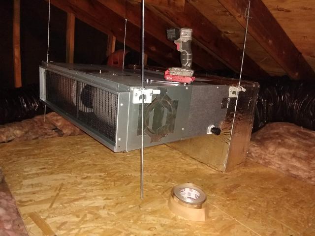 396: Air handler is hung in the attic.   The supply duct manifold is in place.