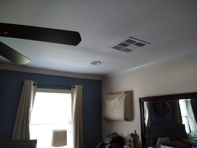 472: We added a blue accent wall, wooden blinds and light blocking curtains, a ceiling fan, LED pot lights, and topped it off with crown moulding.
