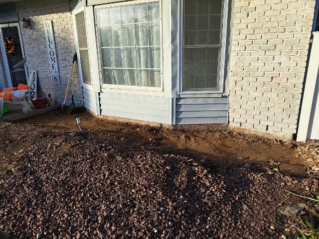 416: Digging out for the front porch slab.