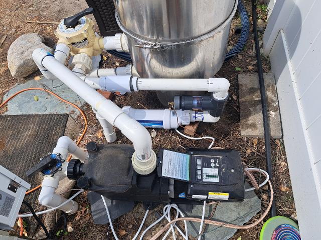 478: A few years back we installed a variable speed pump, which drastically cut our electric usage.   This year, we converted to saltwater.  Wih the price of chlorine, the unit will pay for itself in a season and  a half.   Here you can see the salt cell, flow switch, and sacrificial anode.