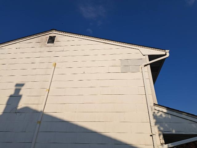 402: Master Bedroom siding is all patched up.